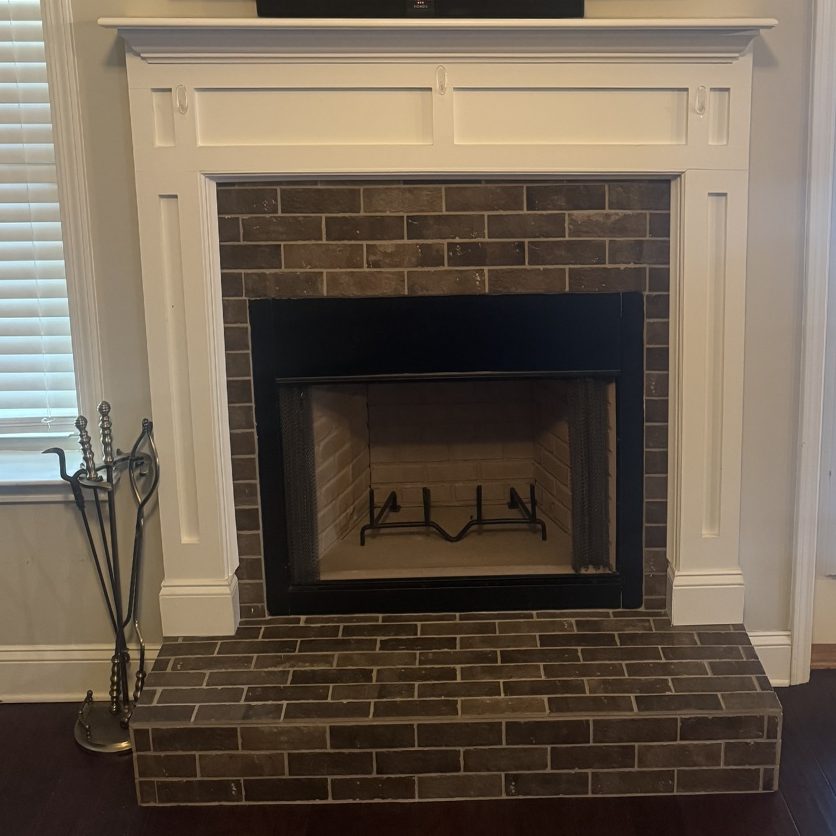 Before: a brick fireplace with a white mantel and a TV above it