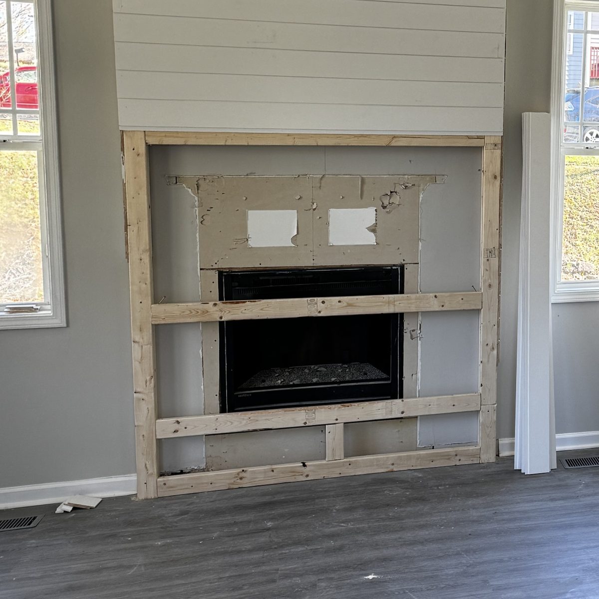 Before: a fireplace surround framed in wood