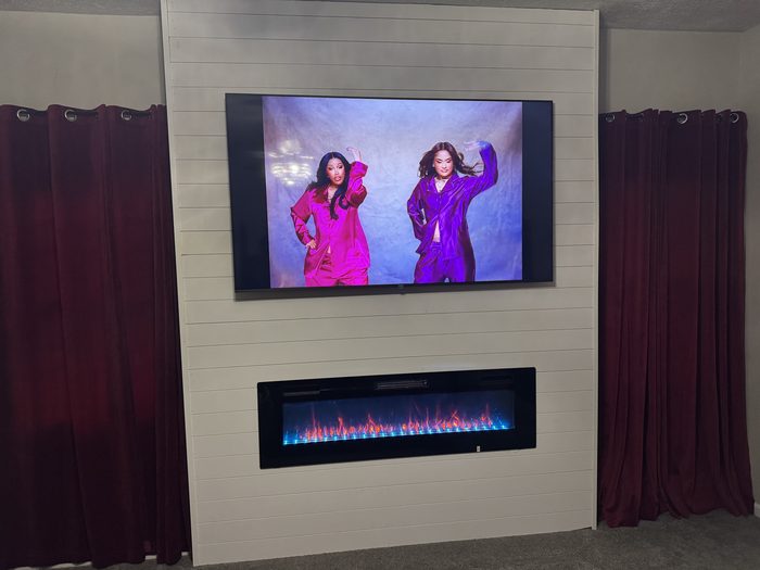 Shiplap TV wall with an electric fireplace